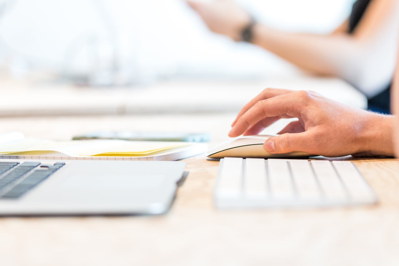 hand on keyboard and mouse